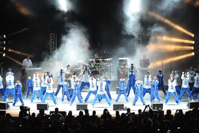 Icon dancers performing on stage.