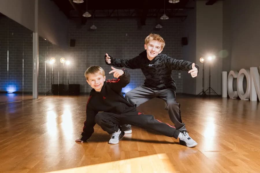 Two young Icon dancers posing in the studio.